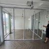 Thi Công Cửa Slim Cover Kính 8mm Cường Lực 8 Cánh Tại Hà Đông